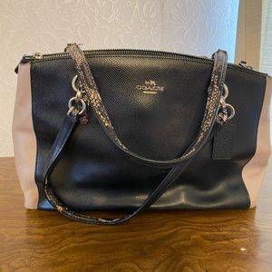 Coach purse. Black with snake handles.